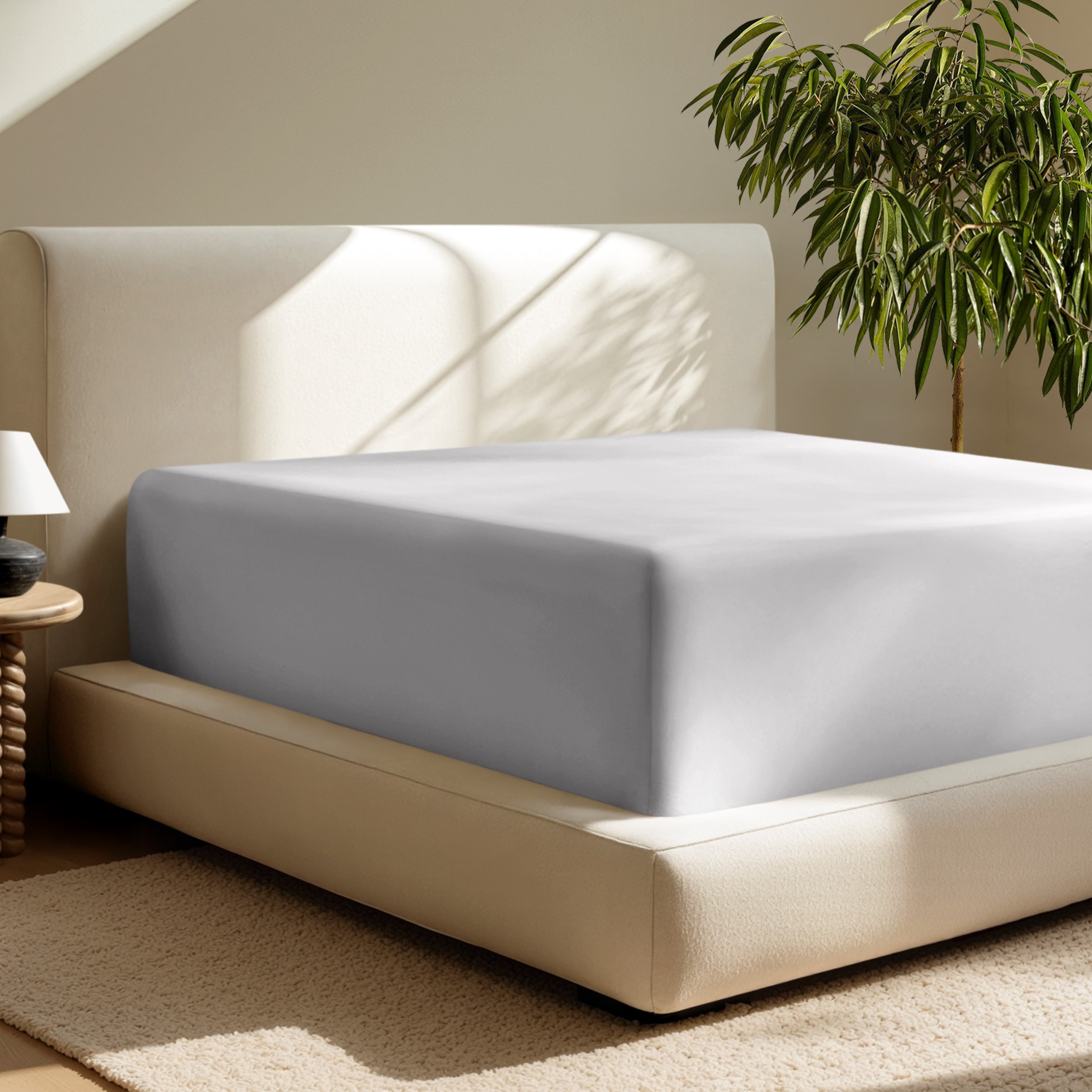 A deep pocket fitted sheet on a mattress