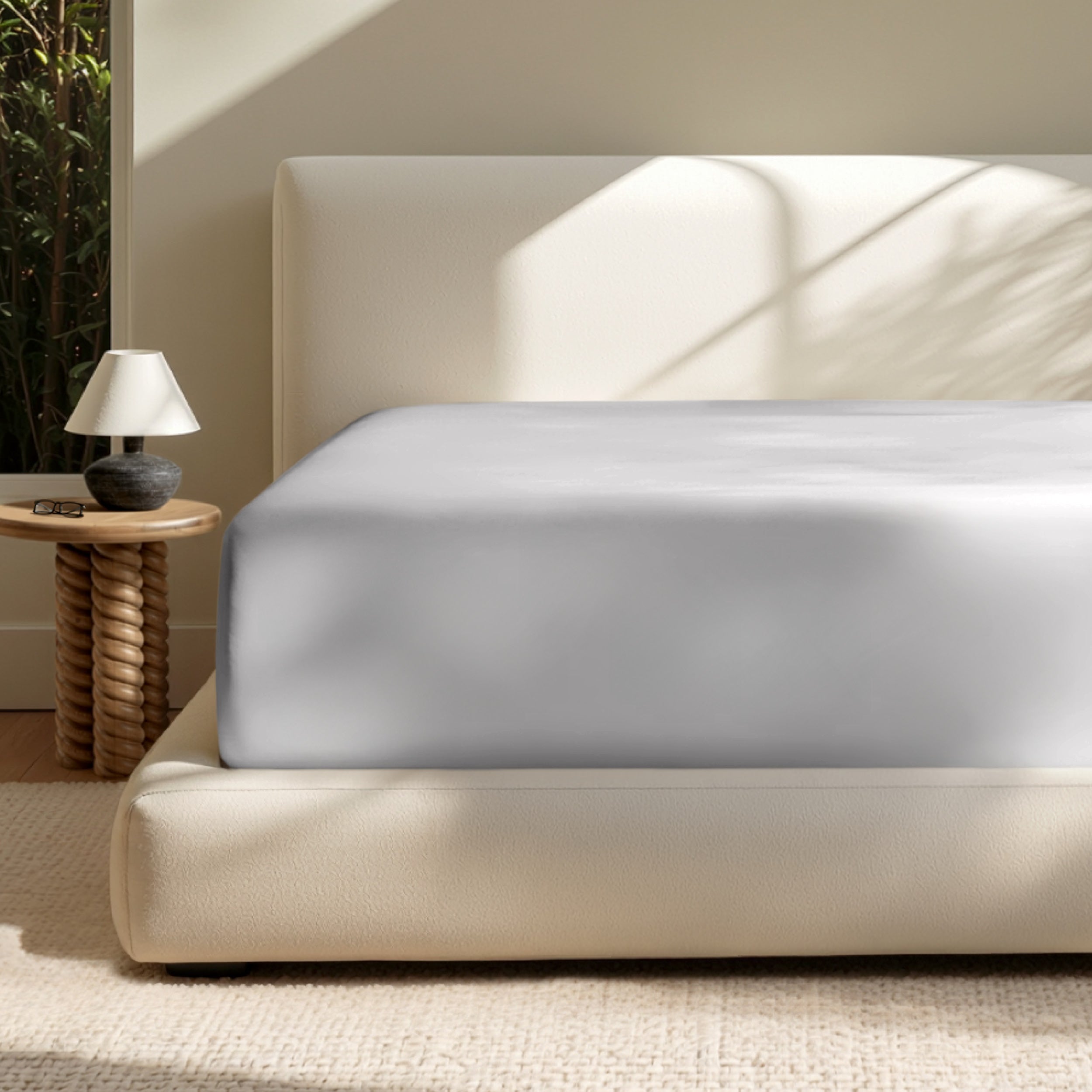 A deep pocket mattress with a fitted sheet on it