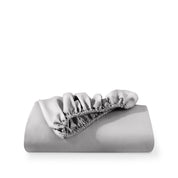 A fitted sheet folded neatly with the all around elastic showing