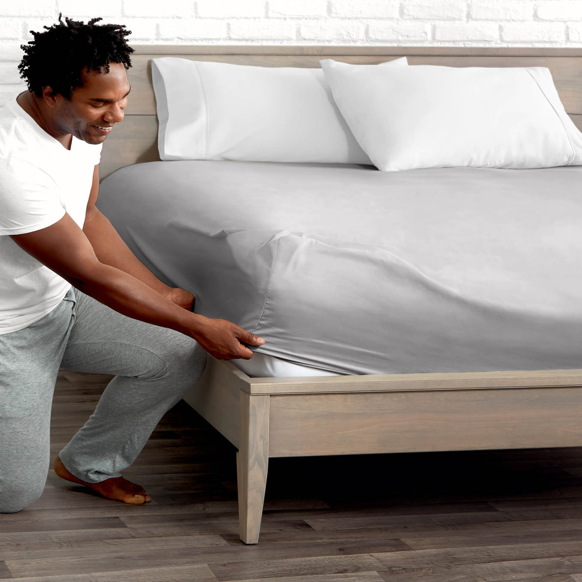 Ultra soft fitted sheet on a mattress with the sun shining into the bedroom
