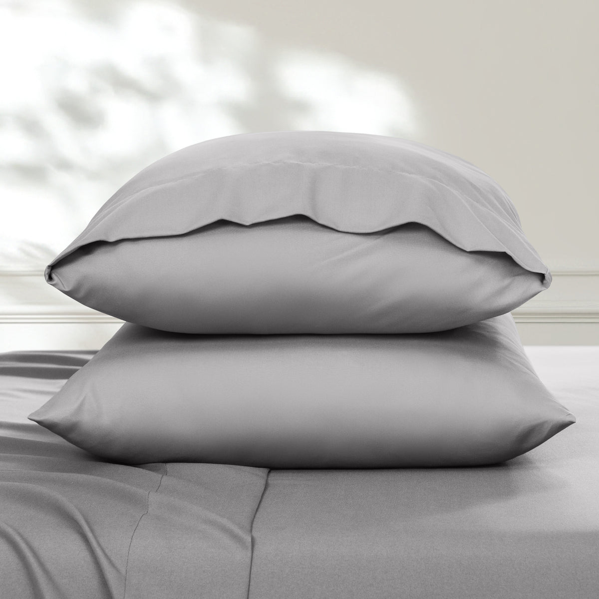 2 pillowcases on pillows