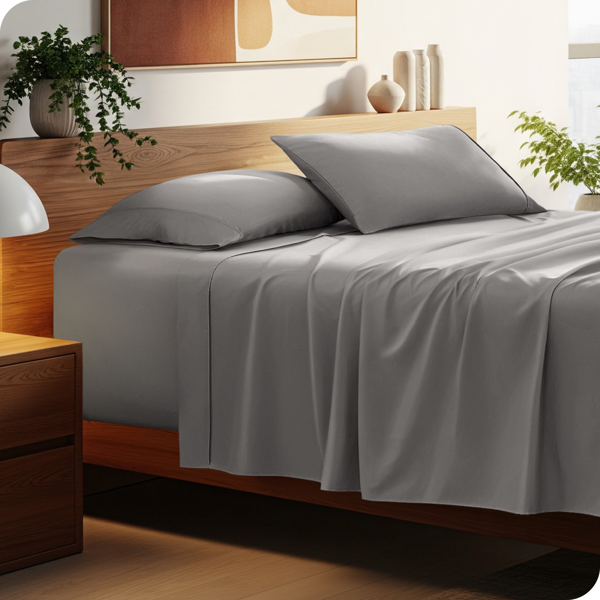 Bed with microfiber bedding and wooden headboard in a bedroom setting