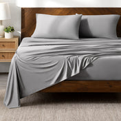 Bed sheets on a wooden bed in a bedroom setting