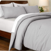 An angled view of a comforter set on a bed