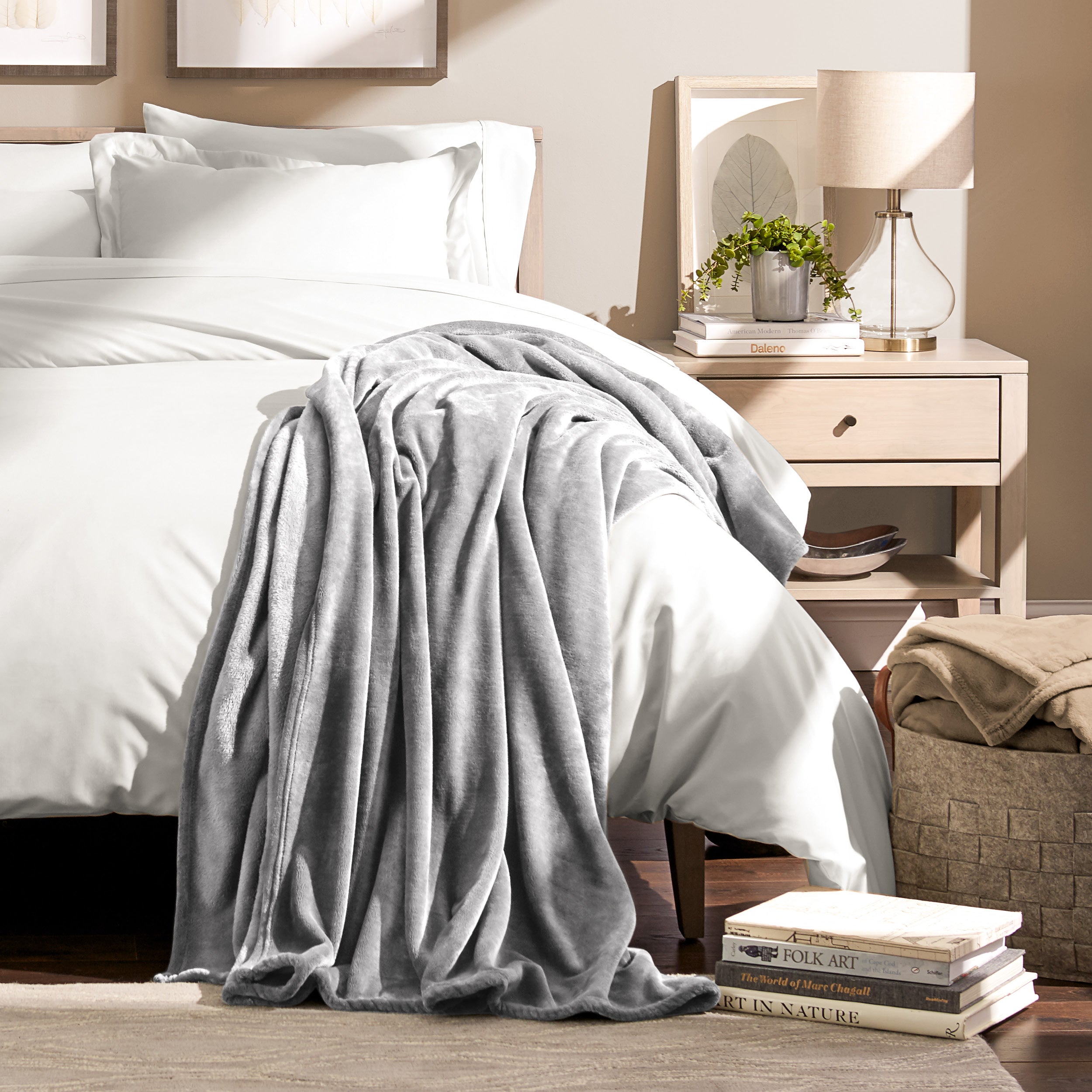 Microplush blanket draped over the corner of a bed