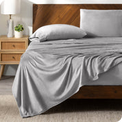 A microplush sheet set on a bed in a modern bedroom.