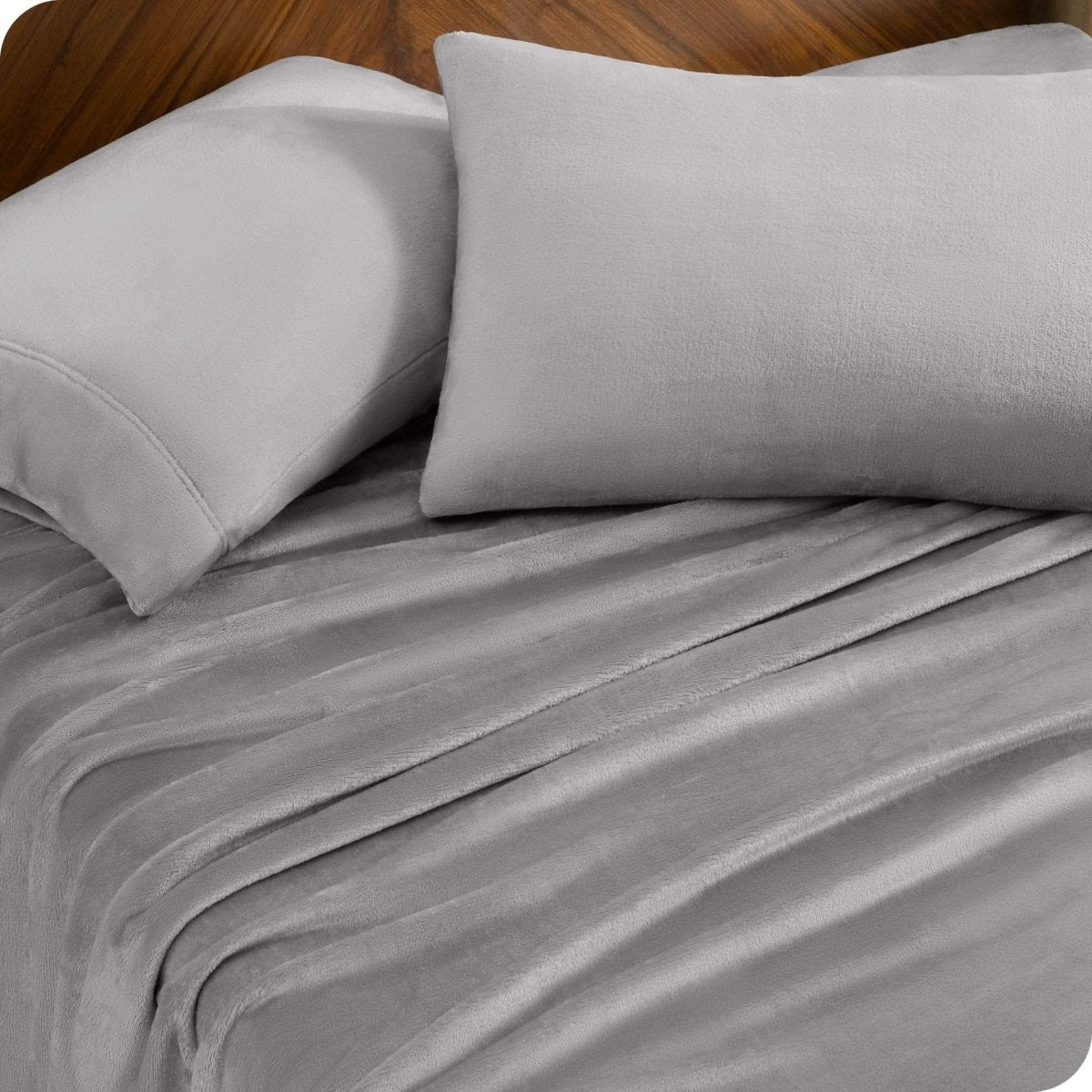 A sheet set and matching pillowcases on a bed.
