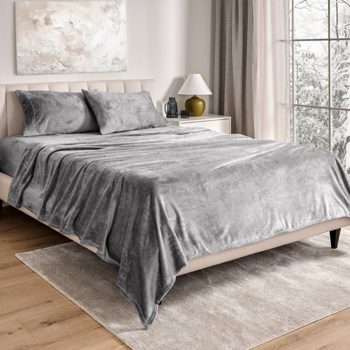 Neatly made bed in a well-lit bedroom.