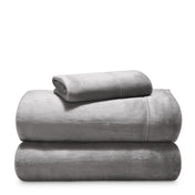 Stack of microplush sheets on a white background