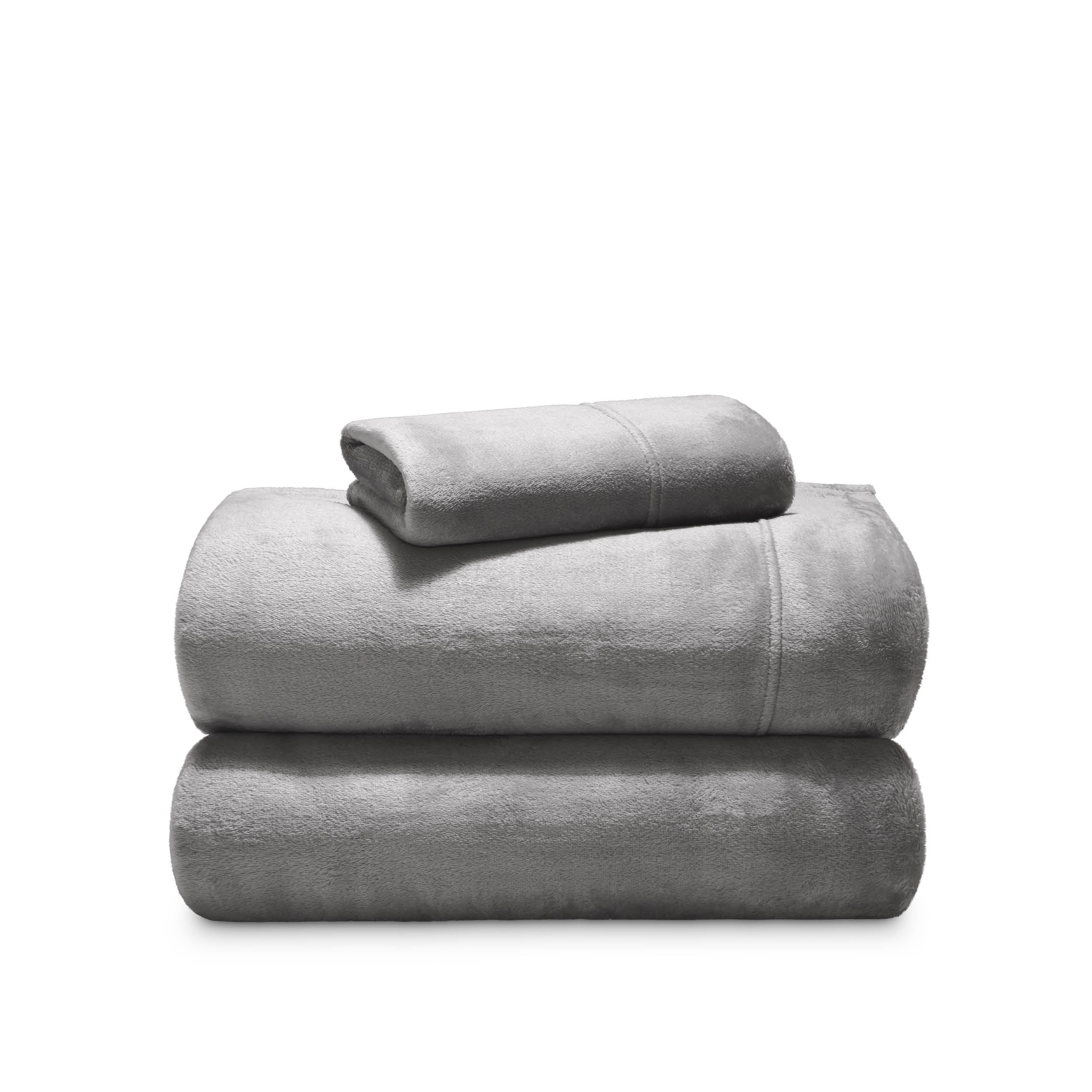 Stack of microplush sheets on a white background