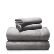 Stack of microplush sheets on a white background