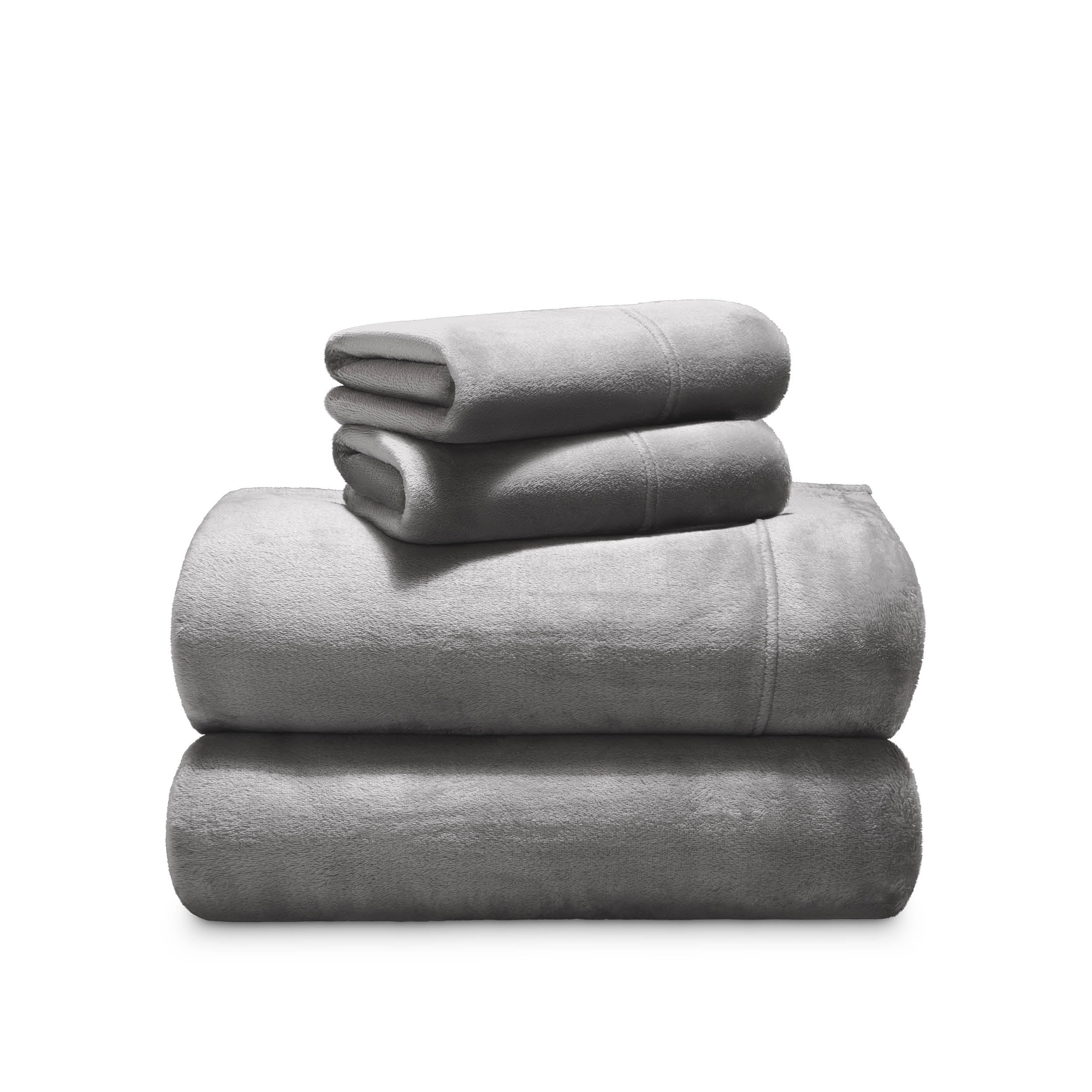 Stack of microplush sheets on a white background