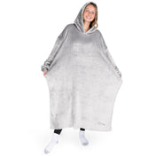 An adult with long microplush wearable blanket on