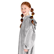 A girl has a microplush wearable blanket on