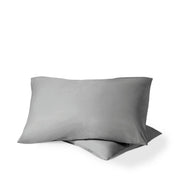Two pillows with percale pillowcases on them