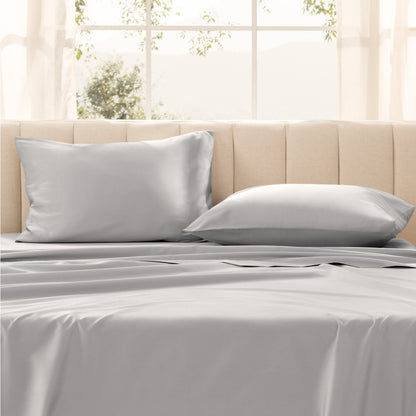 Pillows on a bed with in a bright room.