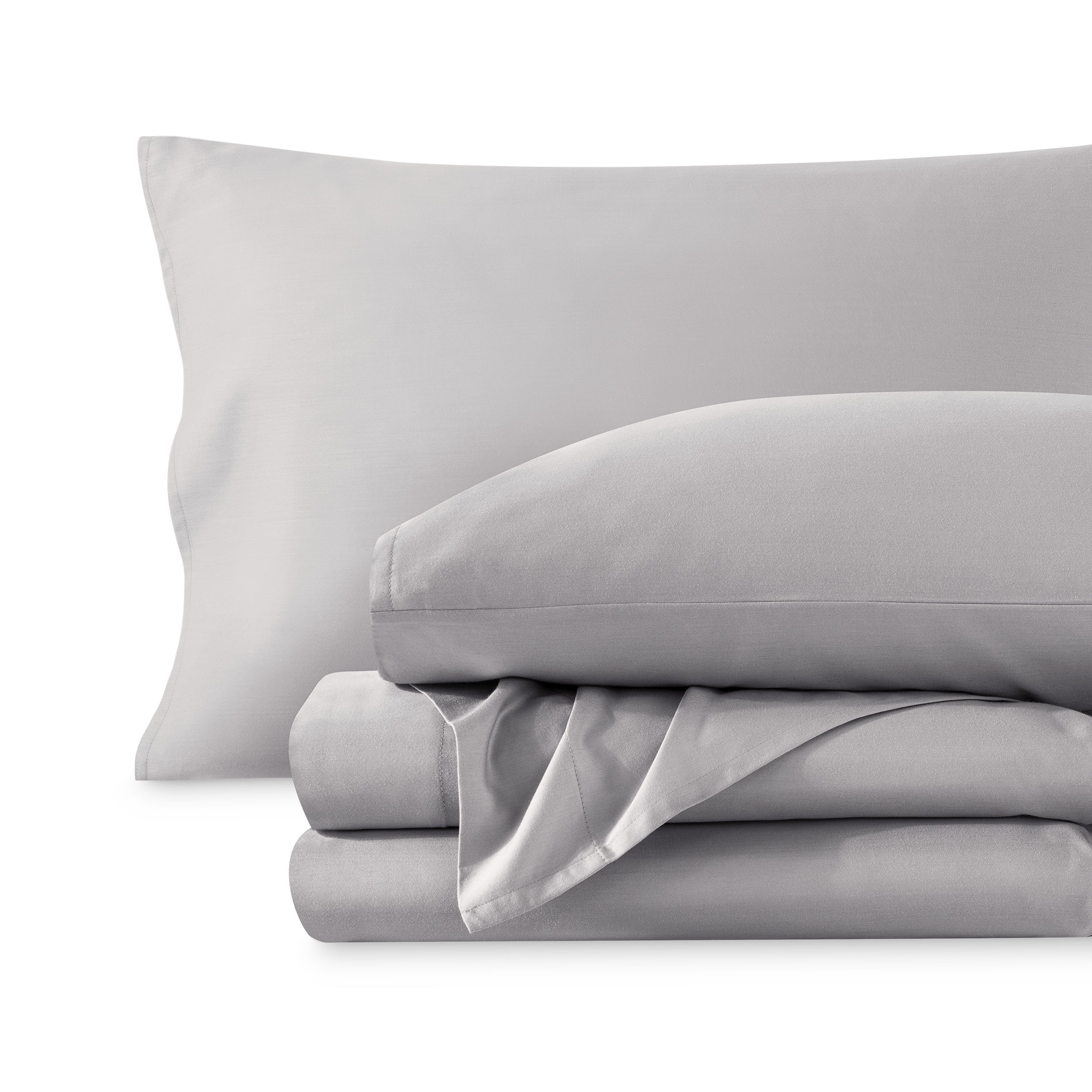 A sateen sheet set folded and stacked on a white background.