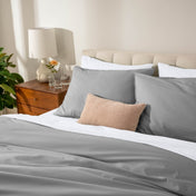 Bed with percale bedding in a bedroom setting