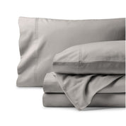 Organic flannel bed sheets and pillowcase set on a white background