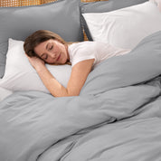 Woman sleeping peacefully under organic jersey bedding