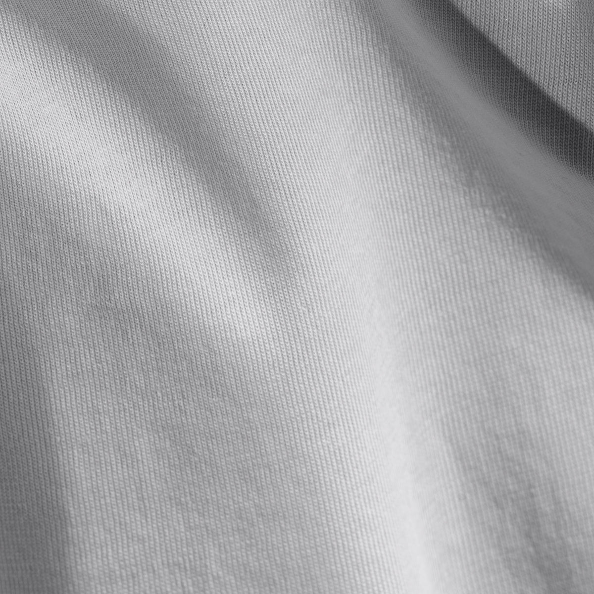 Close-up of organic cotton jersey fabric with subtle texture