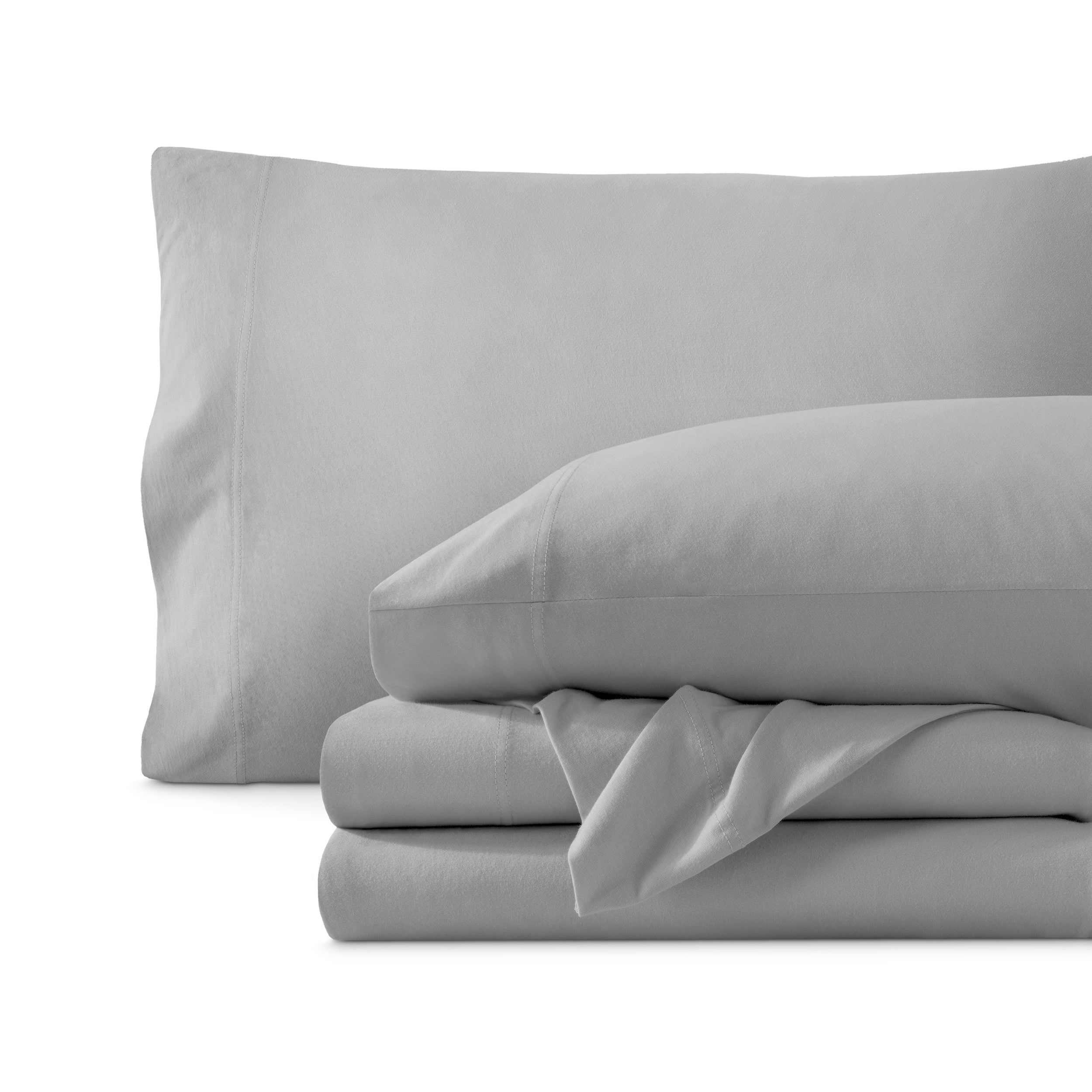 Set of organic cotton jersey sheets on a white background
