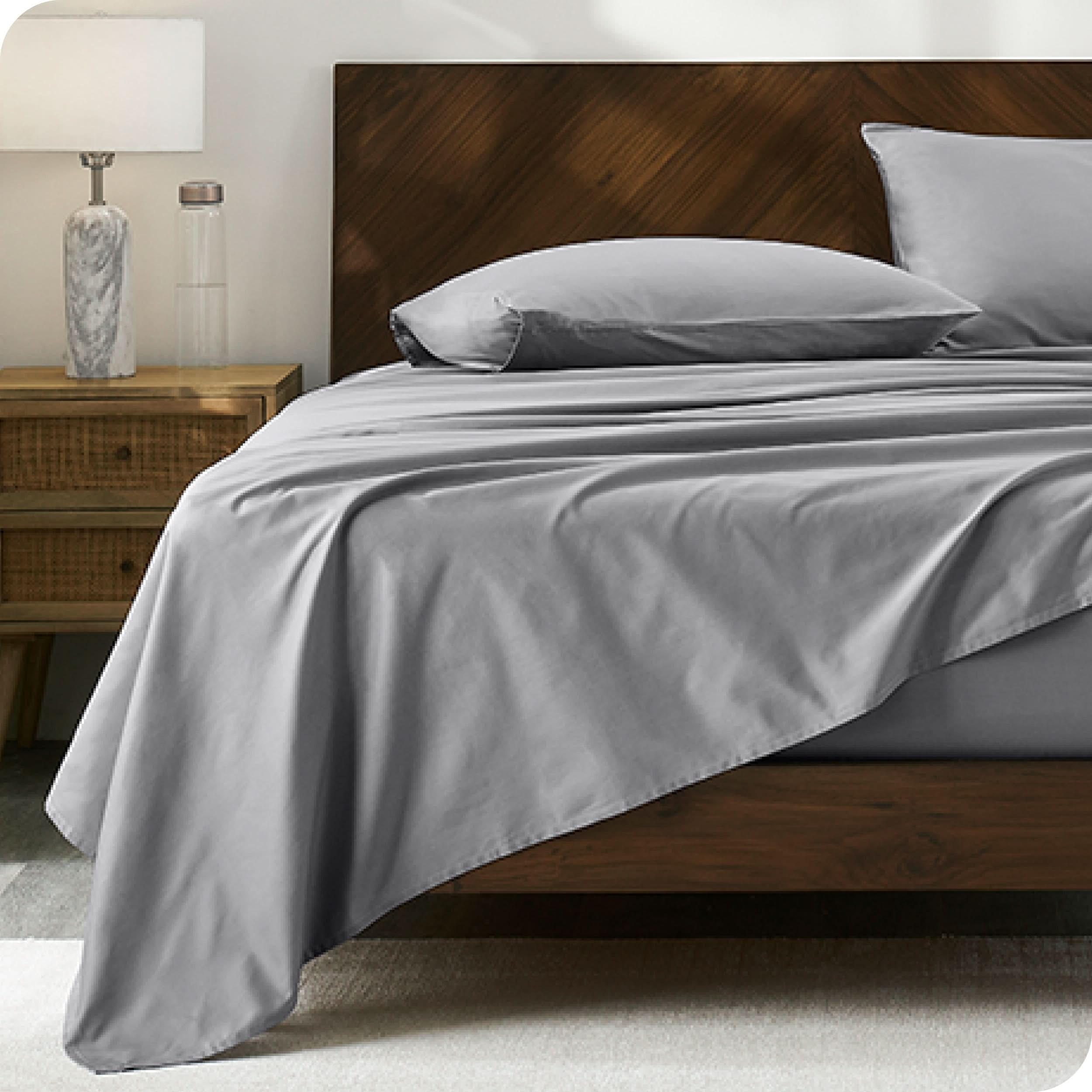 Modern wood bed made with percale sheet set