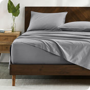 Modern wood bed made with percale sheet set