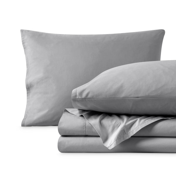 Percale sheets folded and matching pillowcases with pillows in them