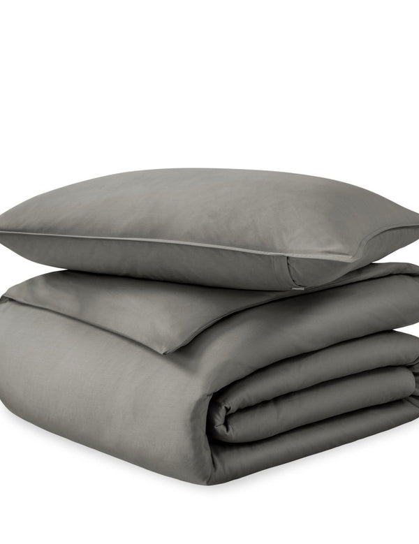 A sateen duvet set arranged in a stack