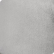 Close up of the corner of a mattress with a fleece fitted sheet on it