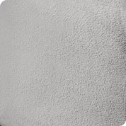 Close up of the corner of a mattress with a fleece fitted sheet on it