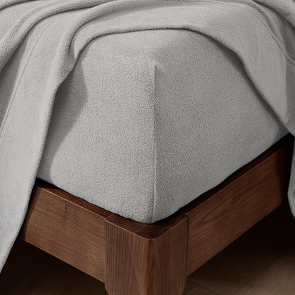 Fitted sheet on a wooden bed frame