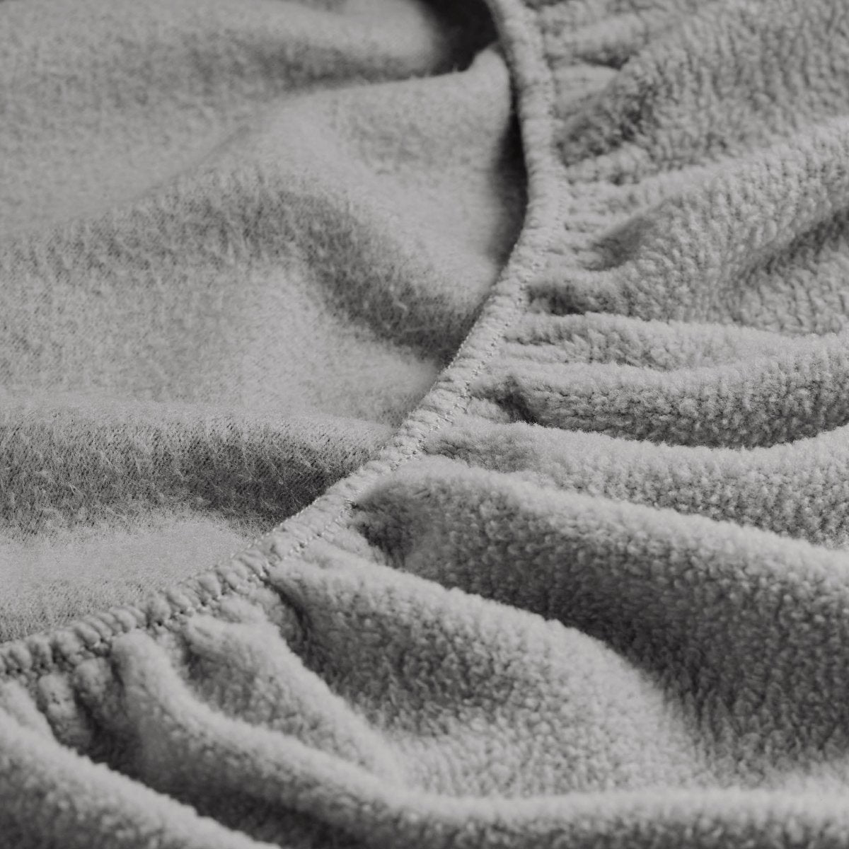 Close-up of a fitted sheet with all around elastic