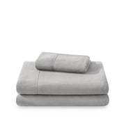 Polar fleece sheets and pillowcases folded and stacked on a white background