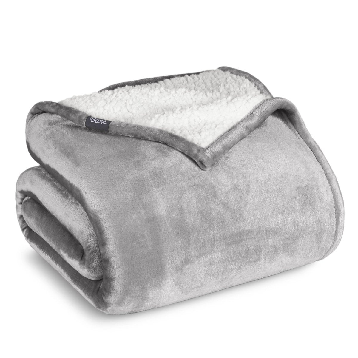 A sherpa blanket folded neatly while showing both sides