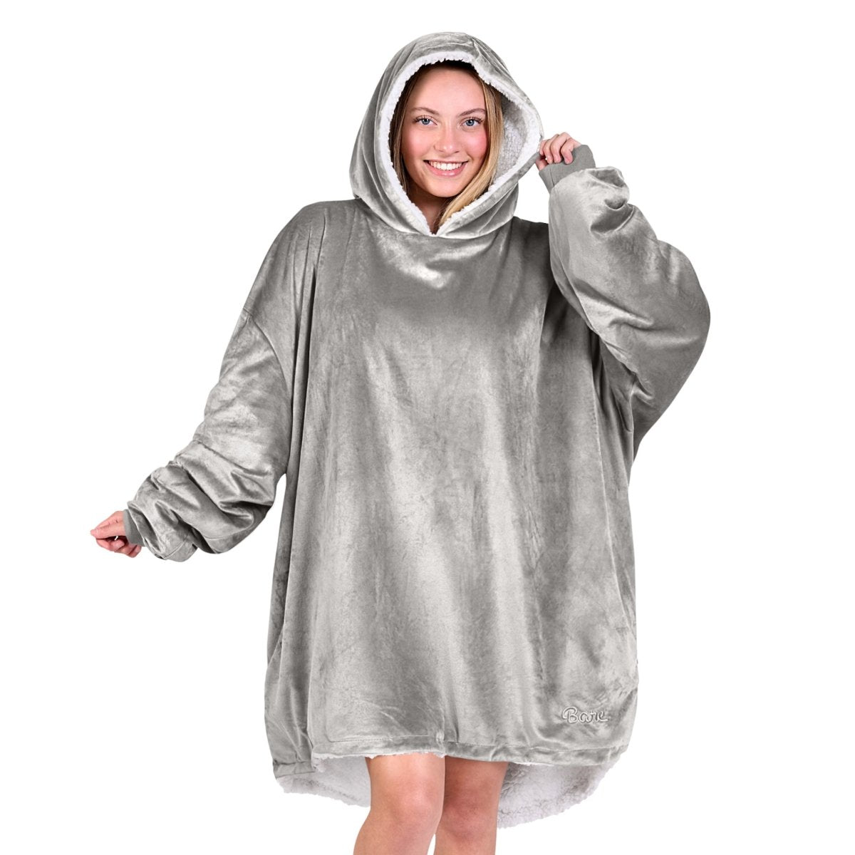 An adult with a sherpa wearable blanket on