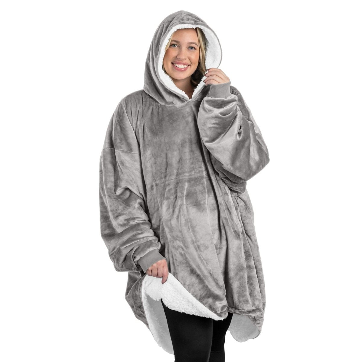 An adult with a sherpa wearable blanket on