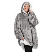 An adult with a sherpa wearable blanket on
