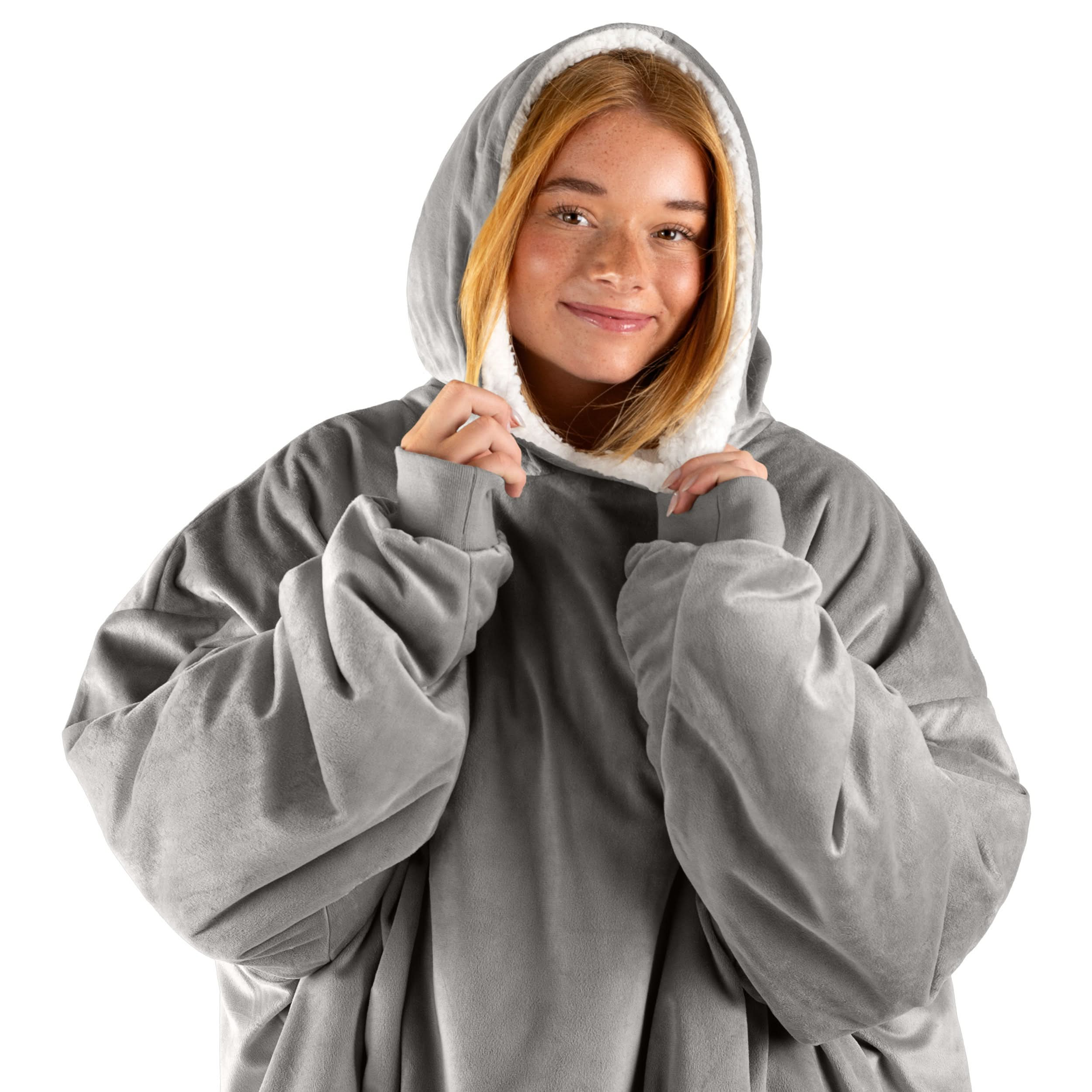 An adult with a wearable blanket on