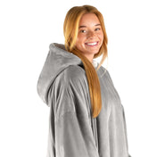 An adult with a sherpa wearable blanket on