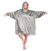 An adult with a hooded wearable blanket on
