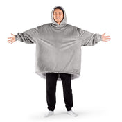 An adult with a sherpa wearable blanket on