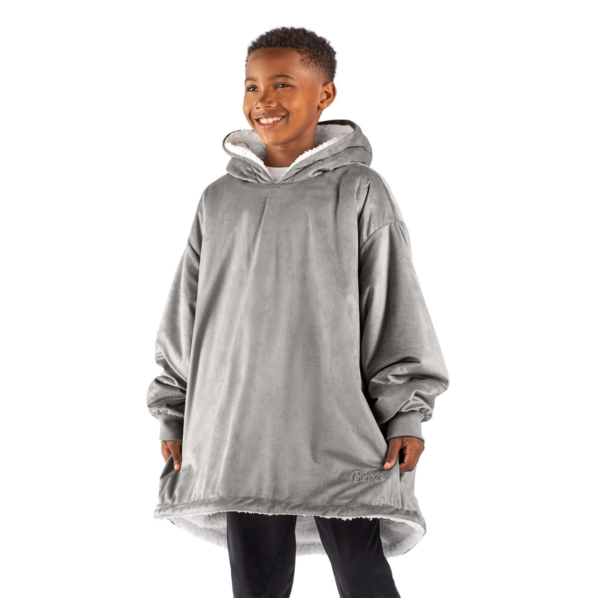 A child with a sherpa wearable blanket on