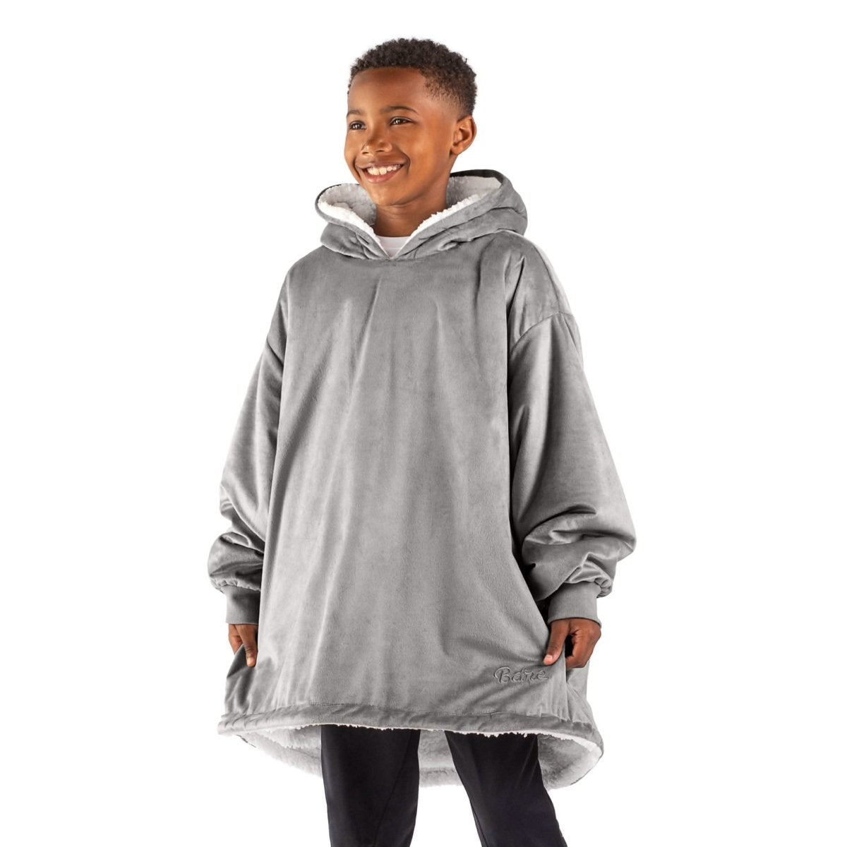 A child with a sherpa wearable blanket on
