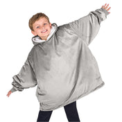 A child with a wearable blanket on