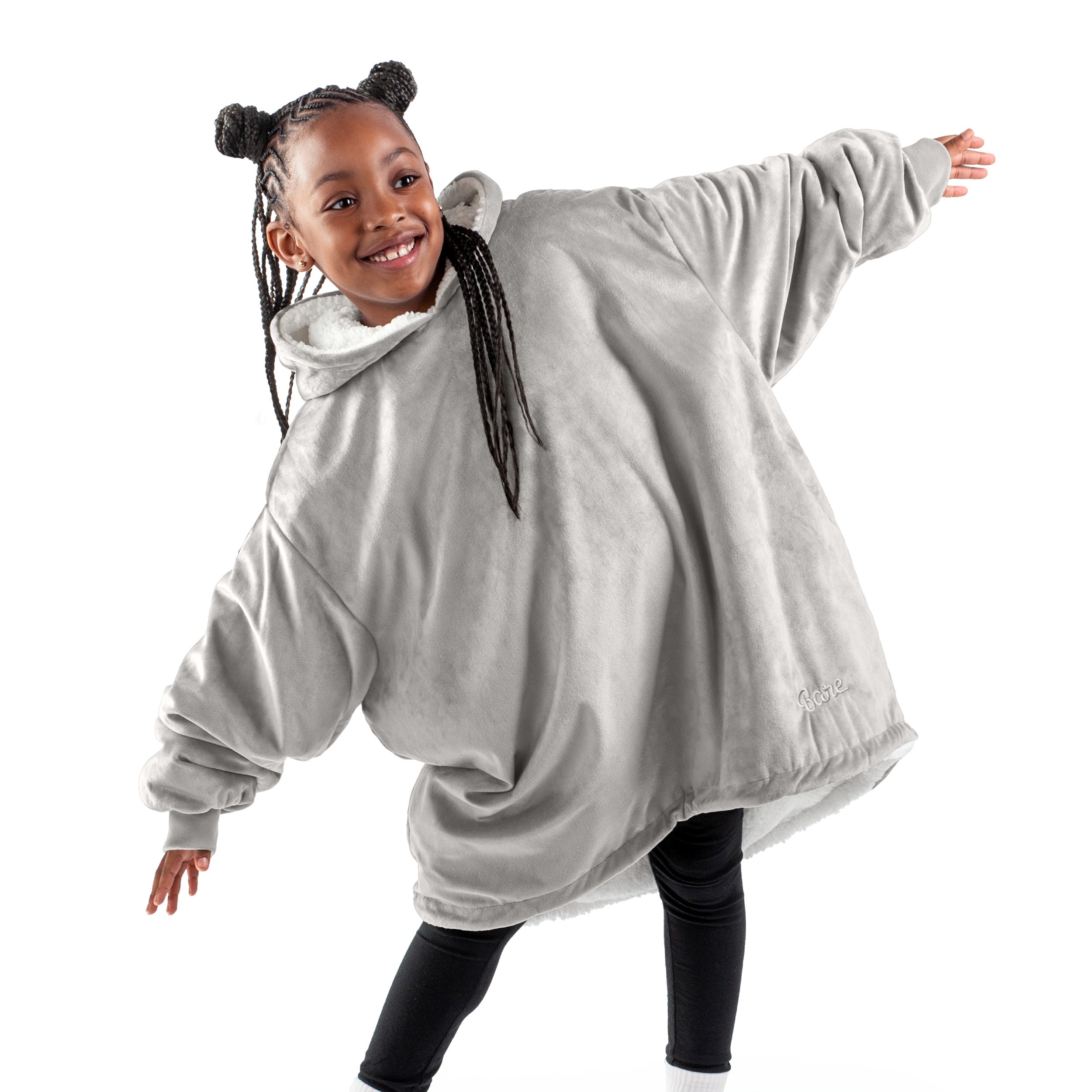 A child with a wearable blanket on