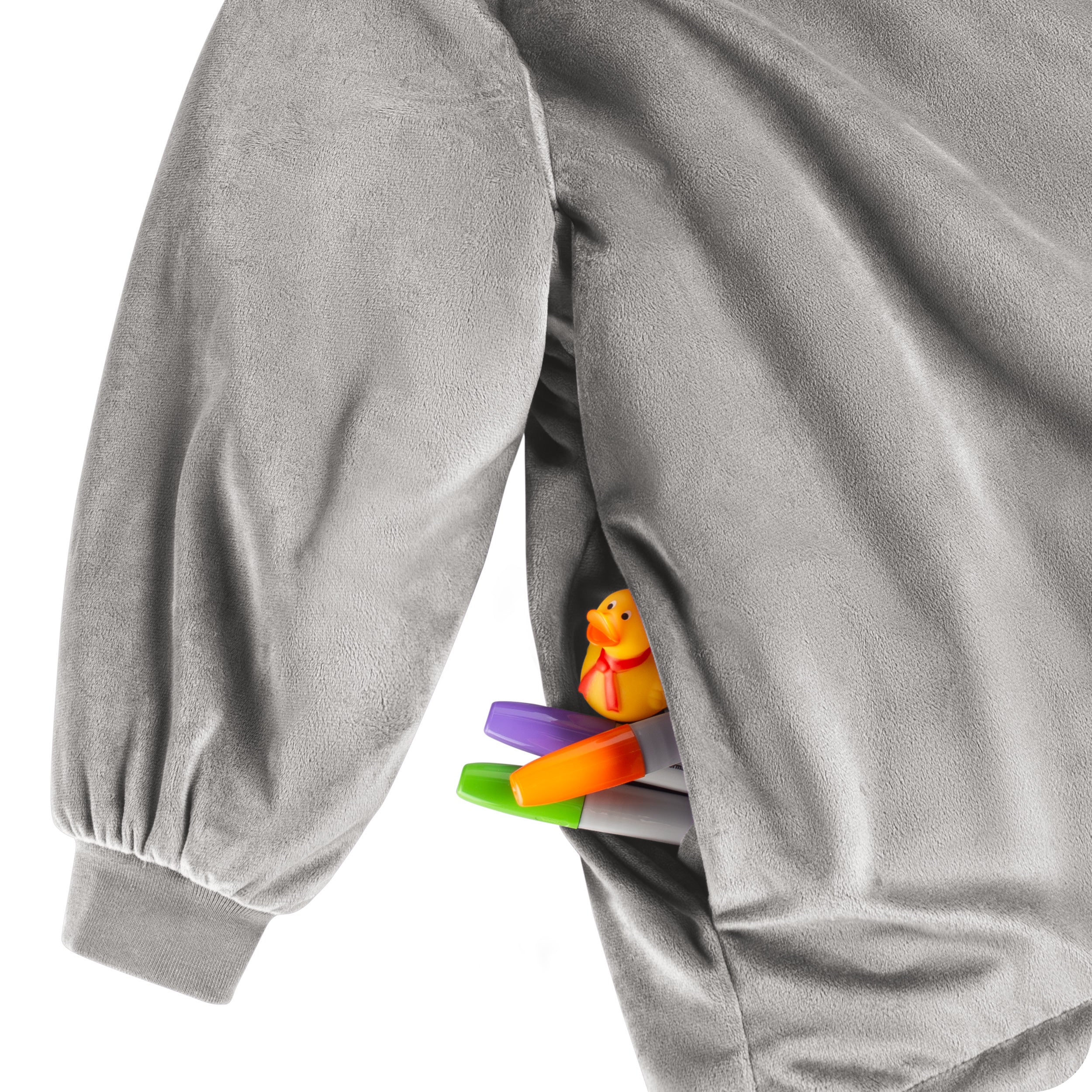 Close up of 1 pocket on the wearable blanket. Some markers and toys are sticking out of the pocket.