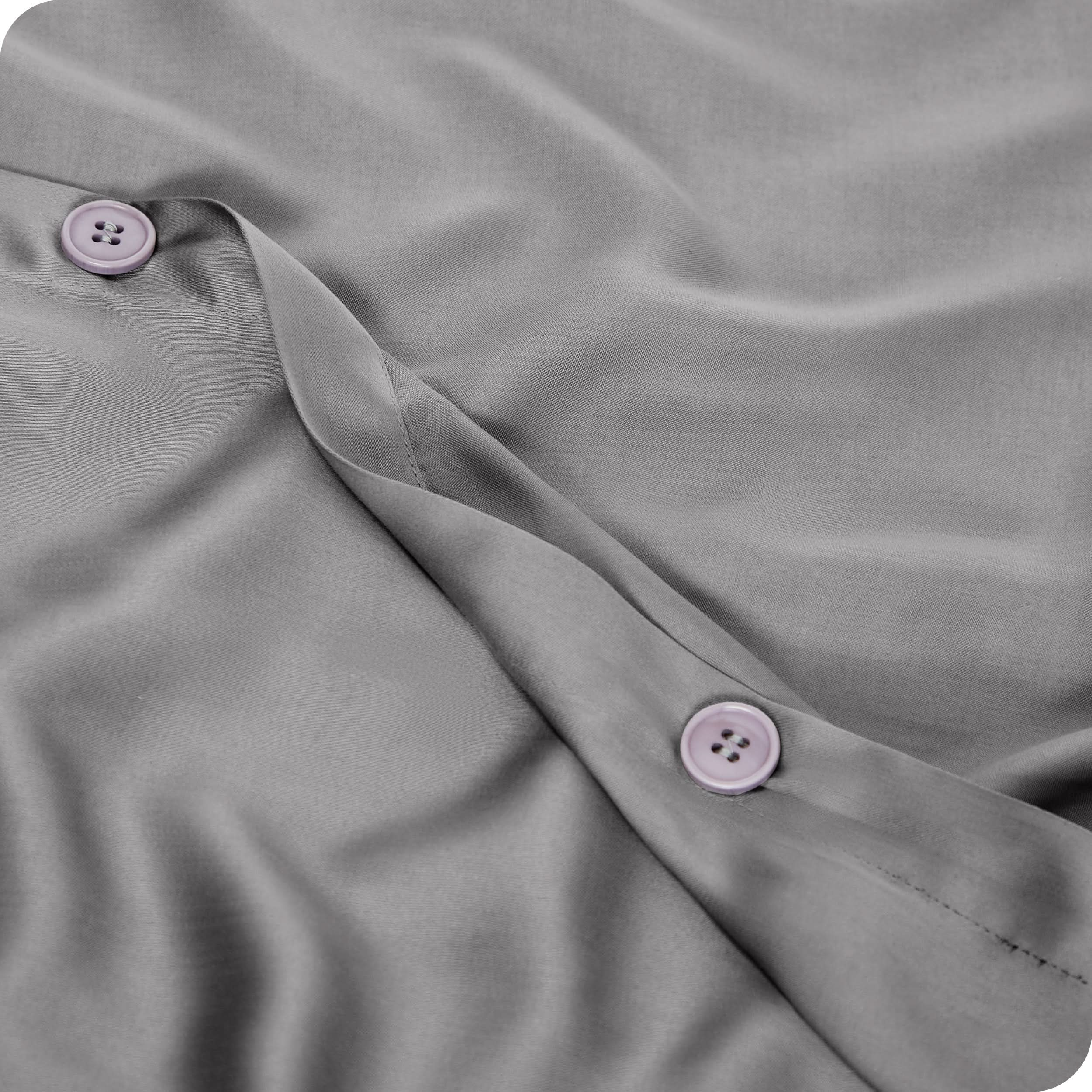 Close up of the buttons on a TENCEL™ duvet cover