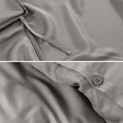 Close-up of duvet ties and button.